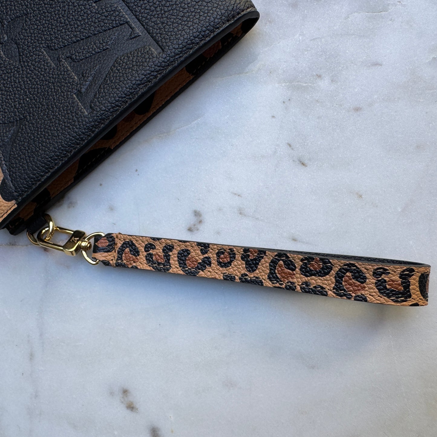 Louis Vuitton Empreinte Monogram Giant Wild at Heart Pochette Wristlet