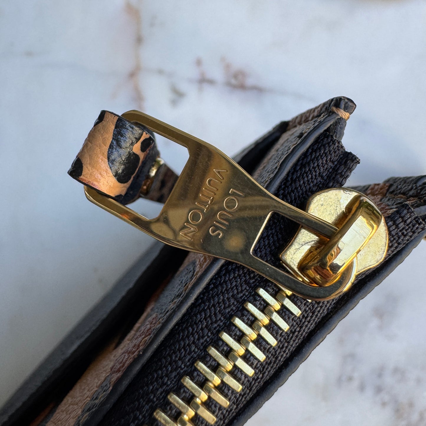 Louis Vuitton Empreinte Monogram Giant Wild at Heart Pochette Wristlet