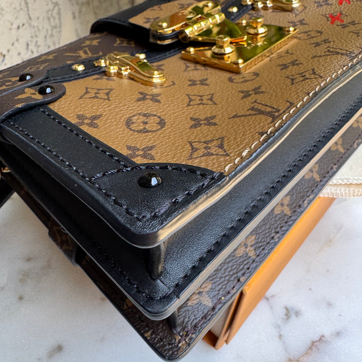 Louis Vuitton Reverse Monogram Trunk Clutch